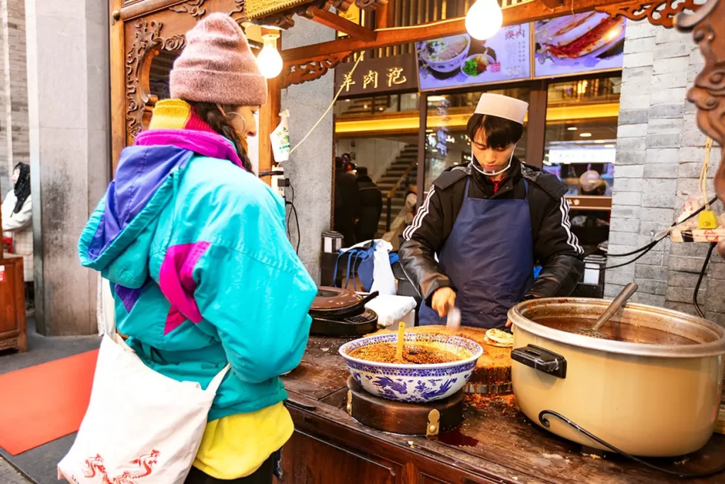 Street food experience at Xi’an Muslim Quarter during China tour