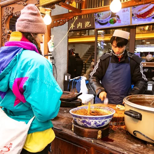 Street food experience at Xi’an Muslim Quarter during China tour