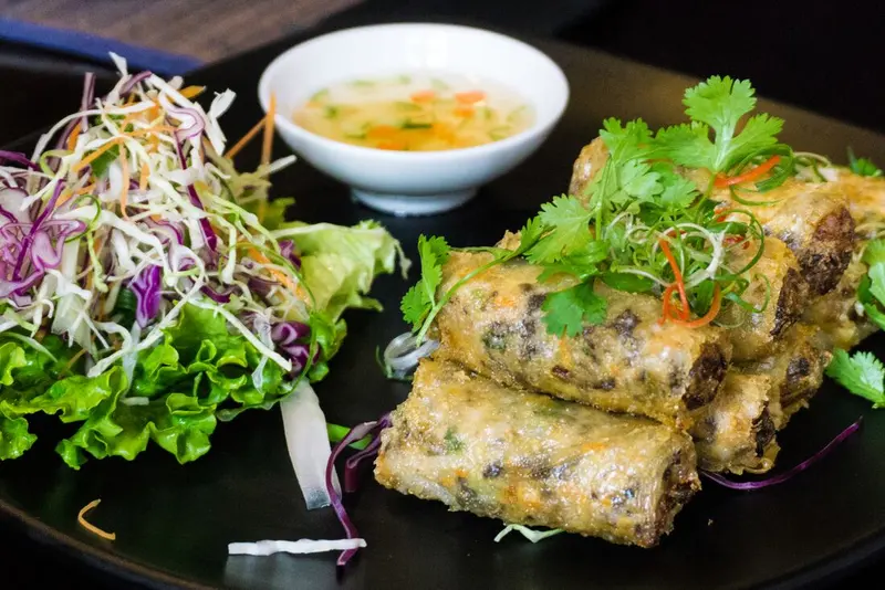 Authentic Vietnamese dishes including pho, banh mi, and fresh local specialties